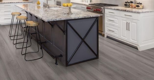 vinyl wood-look flooring in kitchen with large island